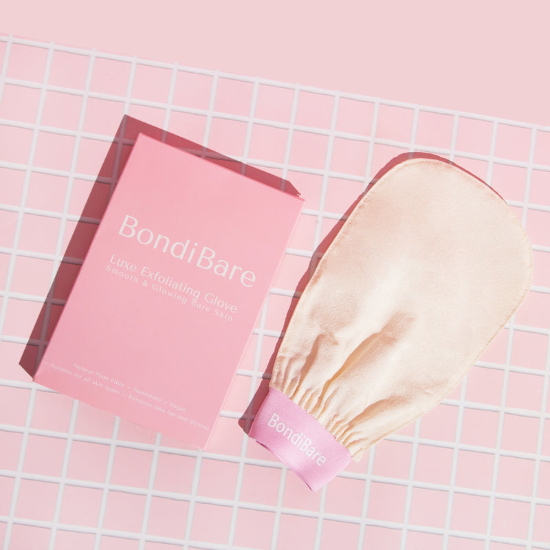 Exfoliating glove with pink band and pink box packaging