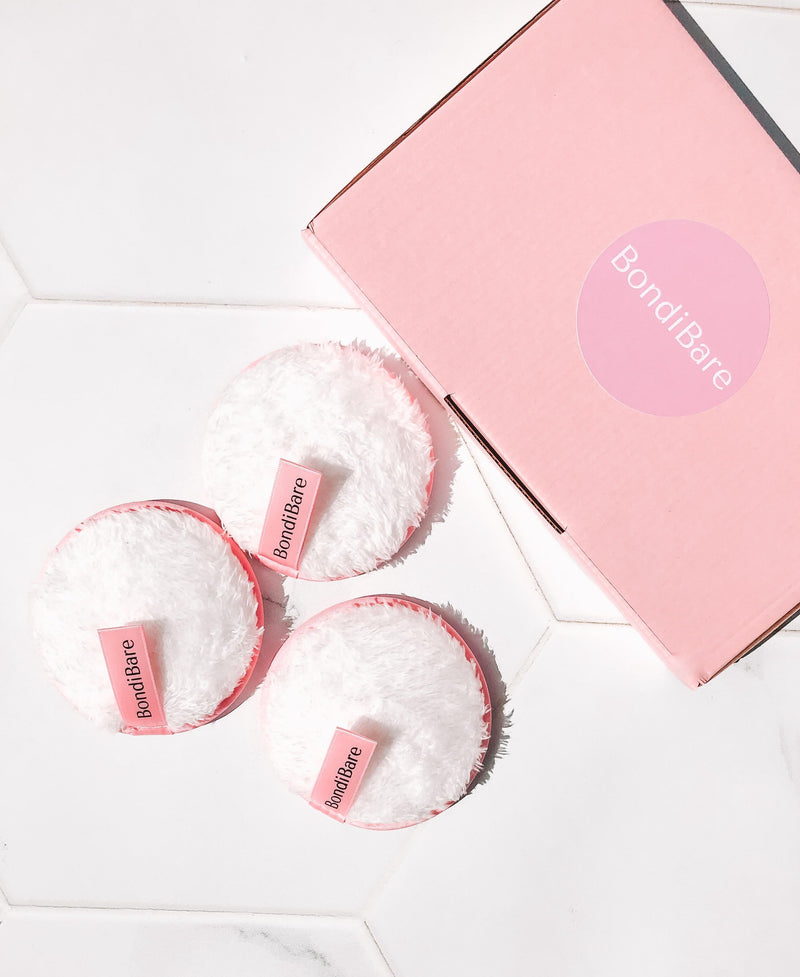 reusable white cleansing face puffs with pink packaging